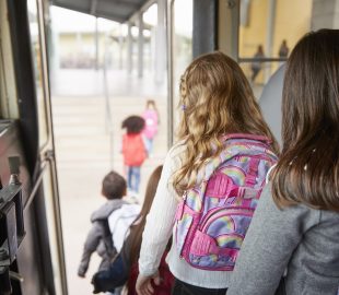 Little kids getting off the bus