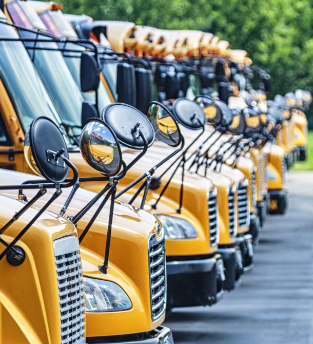 Front of a row of buses parked