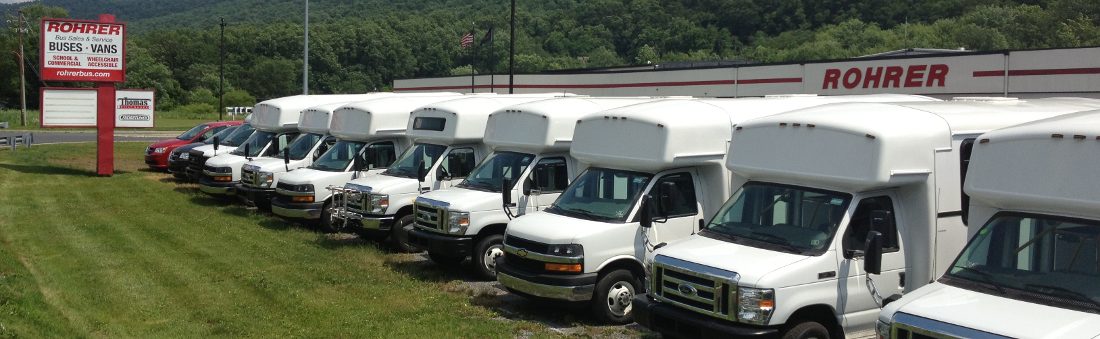 Line of pared Rohrer commercial buses at Rohrer store