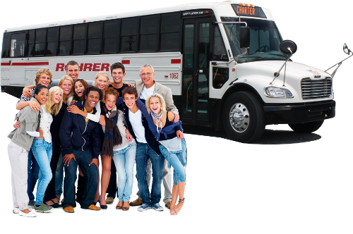 Group of people hugging and laughing in front of white charter bus rental