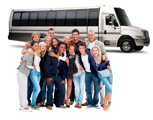 group of people laughing and hugging in front of white coach bus