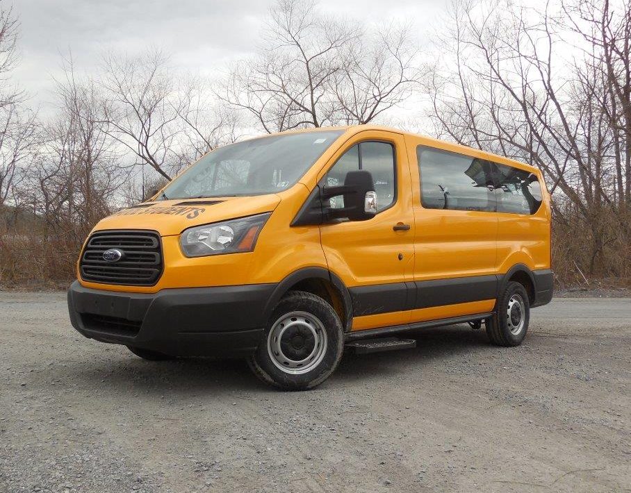 yellow school students van in parking lot